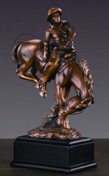 Cowboy Riding on Bucking Horse Statue